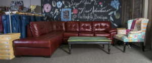 The ultra-comfortable sofa is just outside the fitting rooms, making it a favorite place for husbands to hang-out, too.