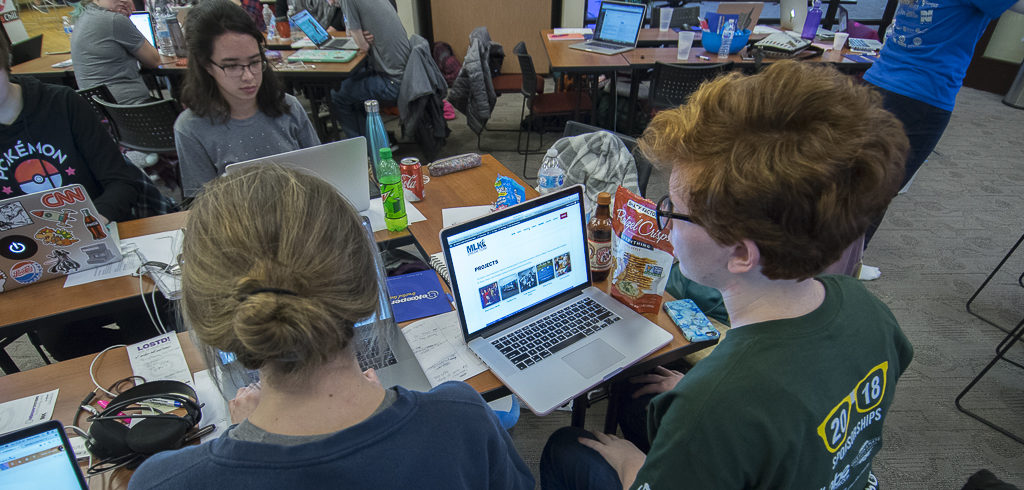 A development team puts the finishing touches on the Martin Luther Dream Team website on Sunday. Photo by: Mike Rhodes