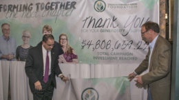 The YOC's unveiling of the total campaign investment reached. The campaign exceed its goal by 13%. Photo by: Mike Rhodes