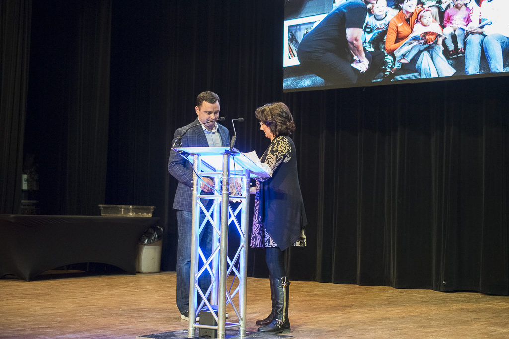 Jenni Marsh prepares to present Casey Stanley with the award at the 2017 Campaign Celebration. Photo by: Mike Rhodes