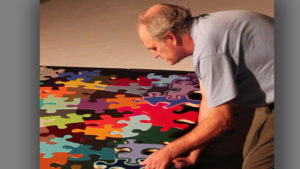 Artist Kevin Campbell is pictured with his "Puzzle Project." Photo provided.