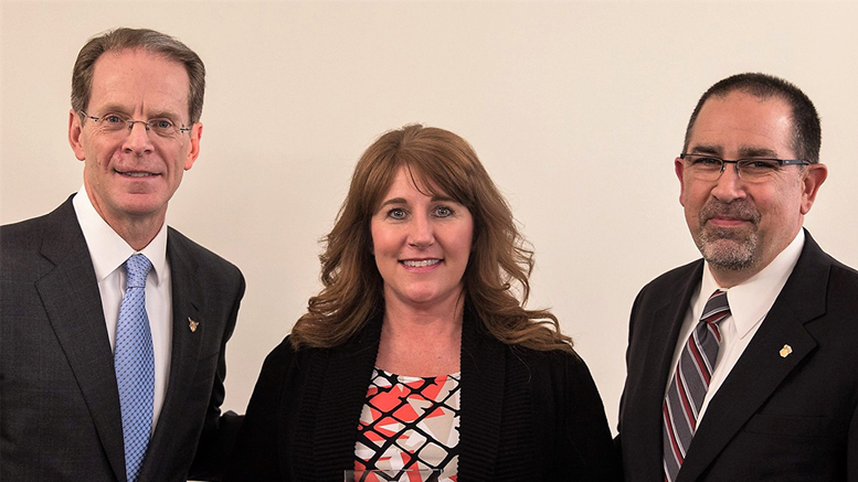 Ball State President Geoffrey Mearns (L) presents the Community Partner of the Year Award to YOC COO, Lynn Doppler and YOC Board President, Jeff Parsons. Photo provided by: YOC