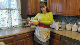 Heather Crouse models the apron she made using a recycled man's shirt.