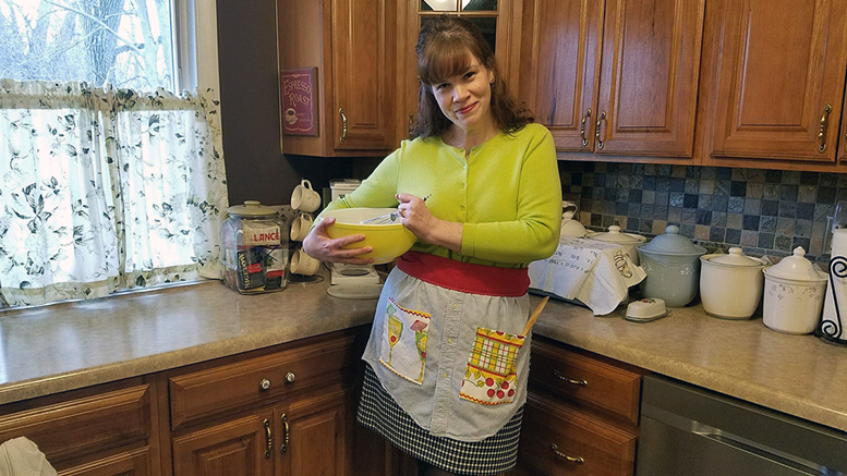 Heather Crouse models the apron she made using a recycled man's shirt.