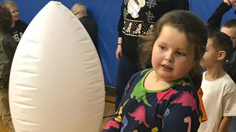 Burris teacher Bethany Clegg expanded a kindergarten classroom unit on dinosaurs into her physical education class. One activity had students completing an obstacle course with dino eggs. Photo provided.