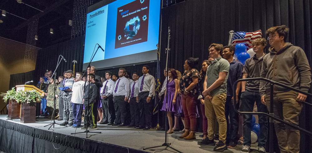 Students take the stage at the end of the State of The City presentation. 