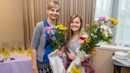 (L-R) Lindsay Huffman and Liz Valpatic are pictured with the flowers they collected during Flower Hour. Photo by: Mike Rhodes