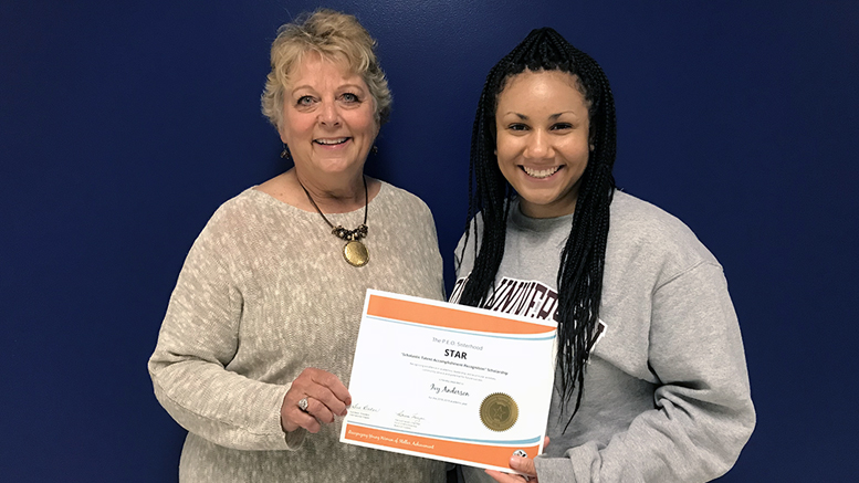 Ivy (R) is pictured receiving her STAR scholarship certificate from P.E.O Cathy Stewart (L) on May 17 at Burris High School. Photo provided.