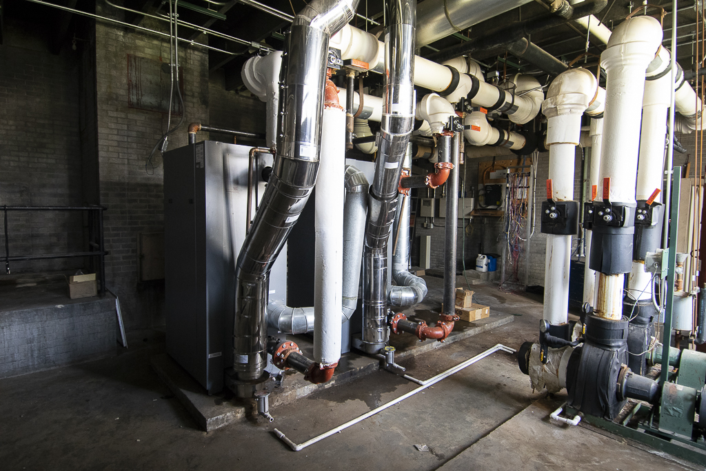 These two relatively new boilers (left side of photo) will be saved and possibly installed at Grissom Elementary. Photo by: Mike Rhodes