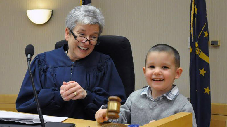 The Honorable Marianne L. Vorhees is pictured with a young child adopted on National Adoption Day. Photo by: Elizabeth Saylor