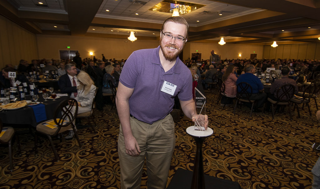 Simon Hoying is pictured with his Spectrum Award for best commercial in market #2. 