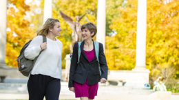 Maddie Clark (left) and Kaitlin Gavenda (right) walk together in front of Beneficence at Ball State University.