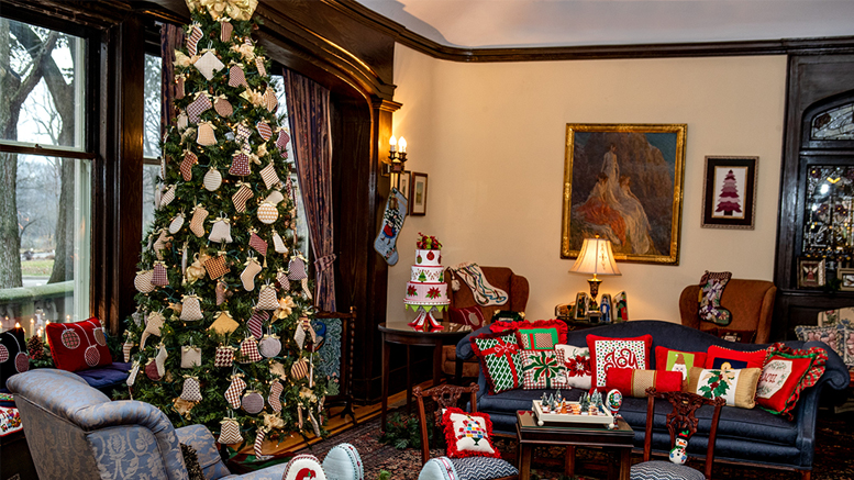 Living room filled with needlepoint ornaments, decorative pillows, and more, all of which were stitched by local women. Photo provided.