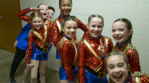 The 82nd Annual Muncie Community Christmas Sing. Students from Cole Academy whoop-it-up for the camera guy while waiting for their turn to perform.