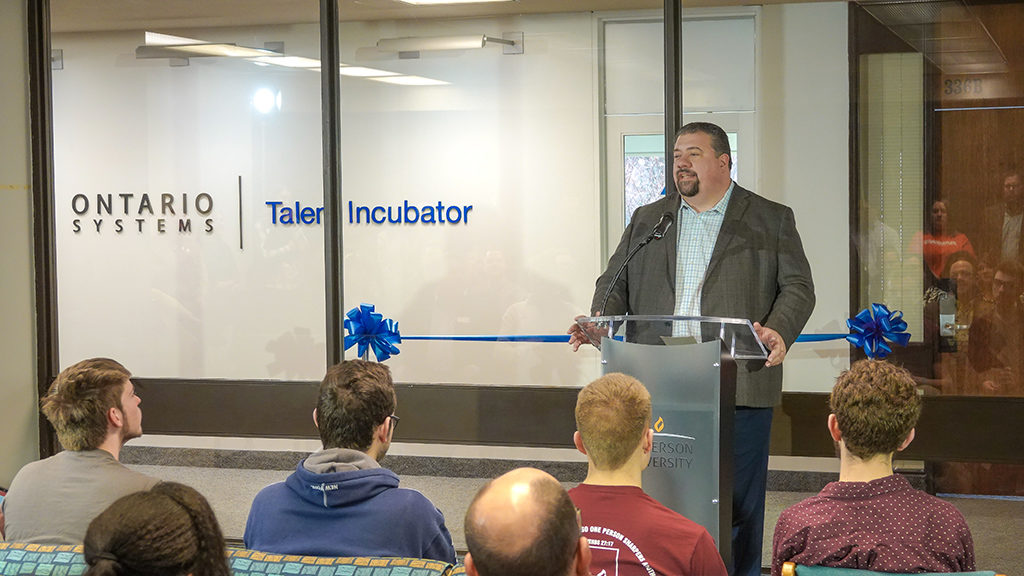 Ontario Systems’ President, Jason Harrington, addresses the assembled guests during the ribbon cutting ceremony on Anderson University’s campus. Photo by: Ontario Systems