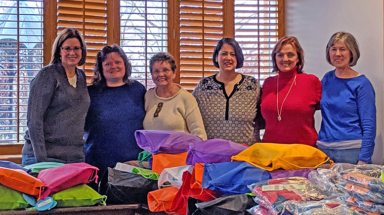 Altrusa International of Muncie, IN, Inc. members pose with care bag items purchased with grant funding from Altrusa International, Inc. Photo provided.