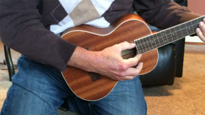 Nothing proves your rock “chops” like playing on your knees. Photo by: Nancy Carlson