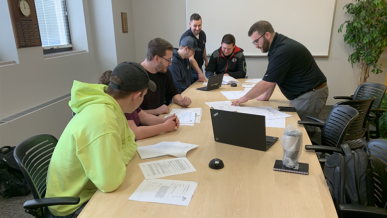 GEC team members strategizing the proposal with a NECA representative. Photo provided