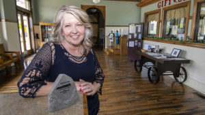 Angie is pictured by the "Outstanding Trail Leaders" award she was presented at the 24th International Trails Symposium in Syracuse, NY. Photo by: Mike Rhodes