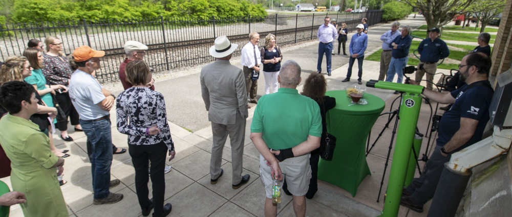 Community leaders, Cardinal Greenway board members, and Grant County partners are pictured as Angie Pool and Mayor Dennis Tyler are interviewed during the RTC live broadcast from the Wysor Street Depot. Photo by: Mike Rhodes