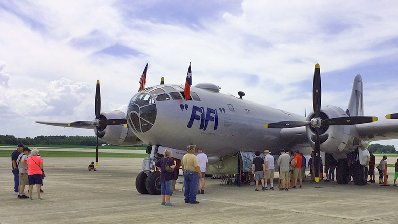 Guests peer into FiFi's nooks and crannies today at the Delaware County Airport. Photo by: John Carlson