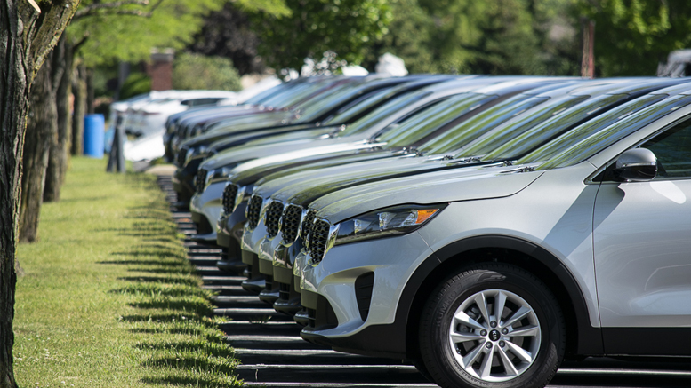 Cars arrive at the Toyota of Muncie tent sale in the parking lot by Ball State's Scheumann Stadium. Photo by: Mike Rhodes