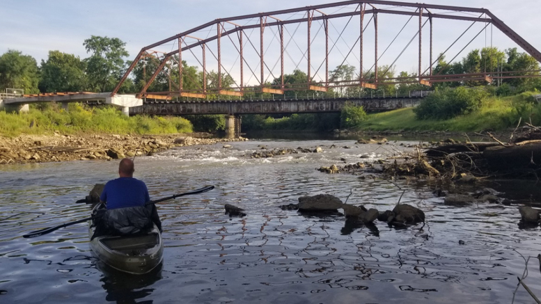 Angler fishing for small mouth bass below the Kitselman Bridge. Photo provided.