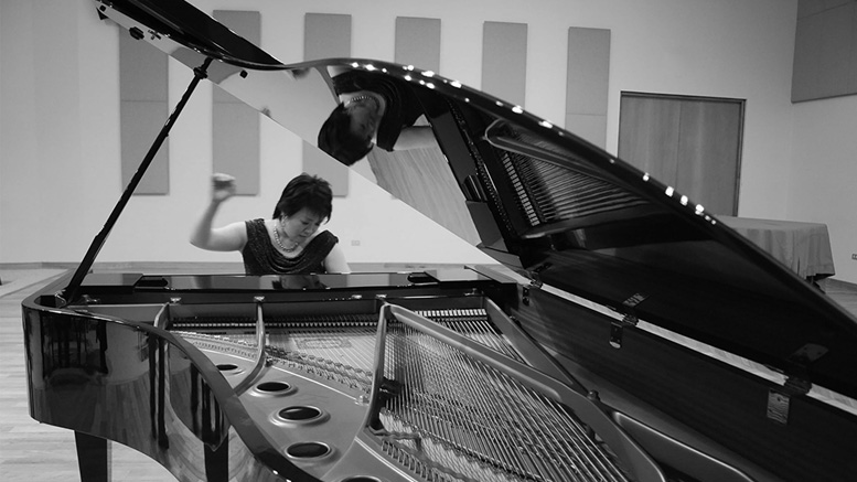 Dr. Angelin Chang at the grand piano. Photo provided