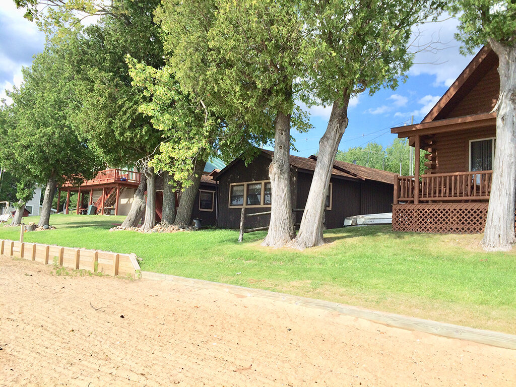 Rustic cabins along the shoreline of pristine Black Lake. Photo by: Nancy Carlson