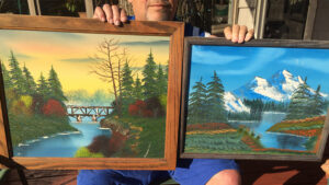 Bobby Wilson’s paintings add warmth to my man cave. Photo by: Nancy Carlson