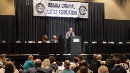 Opening session keynote speaker Andrew Collins is pictured discussing his experience framing an innocent man who later became his friend. Photo by: Mike Rhodes