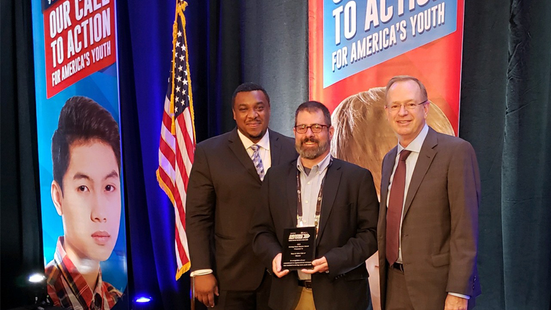 Jason Newman is pictured with the award recently received during ceremonies held in Chicago, IL. Photo provided