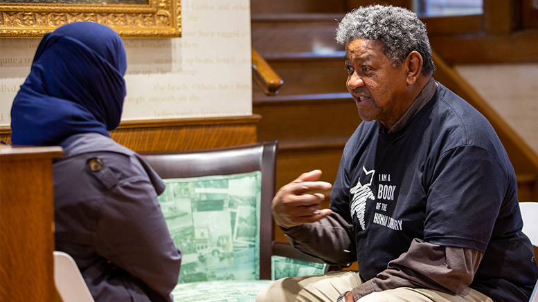 A book and a reader engage in dialogue to uncover and confront stereotypes. Photo provided