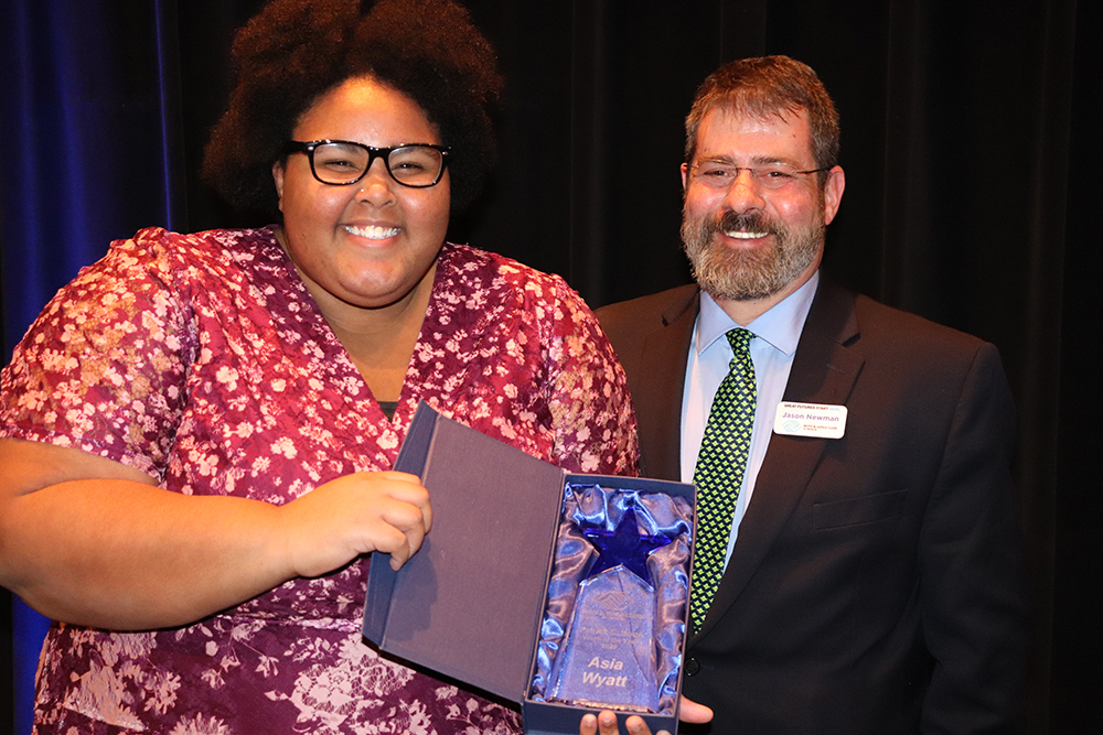 Jason Newman, CEO of The Boys & Girls Clubs of Muncie presents the 2019 Patrick C. Botts Youth of the Year Award to Asia Wyatt. Photo provided