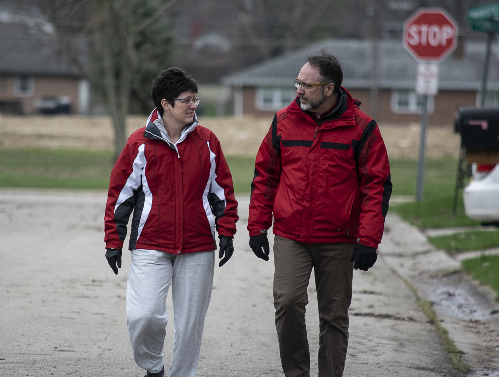 Kelly and Joel Shrock take a walk in their neighborhood.