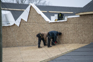 Men at work on the roof of the new Texas Steakhouse