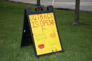Handwritten sign for Outback Steakhouse