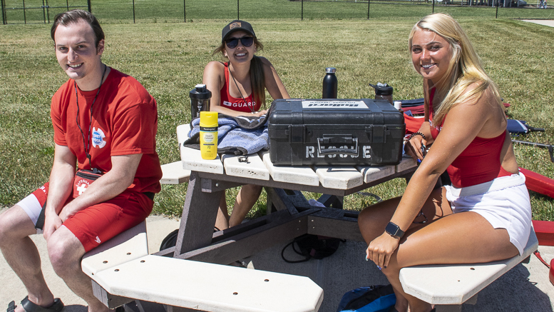 New lifeguards for the season are pictured as they wait for kids and families to enter the pool area on June 15th. Photo by: Mike Rhodes