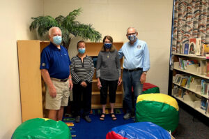 Tom Alexander, Gloria Adams, Felicia and David Dixon at Cowan Elementary School. Photo by Scott Metzler