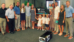 From left: Chris Cook, Dave Heeter and Chris Caldwell, representing Northwest, with Pat’s family -- Taylor Botts, Adam Botts, Jane Botts, Molly Bucholtz, Sam Bucholtz, Jake Bucholtz, Archie Botts, Jordan Botts, Ben Botts, Erica Bucholtz and Jason Bucholtz -- gathered to dedicate the Pat Botts Free Children’s Library.