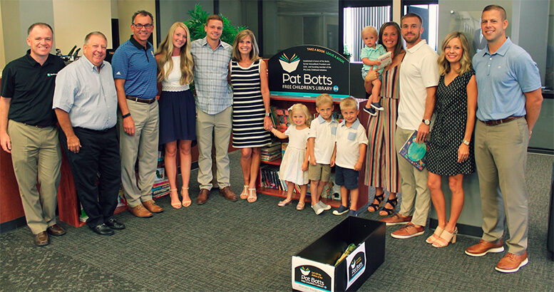 From left: Chris Cook, Dave Heeter and Chris Caldwell, representing Northwest, with Pat’s family -- Taylor Botts, Adam Botts, Jane Botts, Molly Bucholtz, Sam Bucholtz, Jake Bucholtz, Archie Botts, Jordan Botts, Ben Botts, Erica Bucholtz and Jason Bucholtz -- gathered to dedicate the Pat Botts Free Children’s Library.