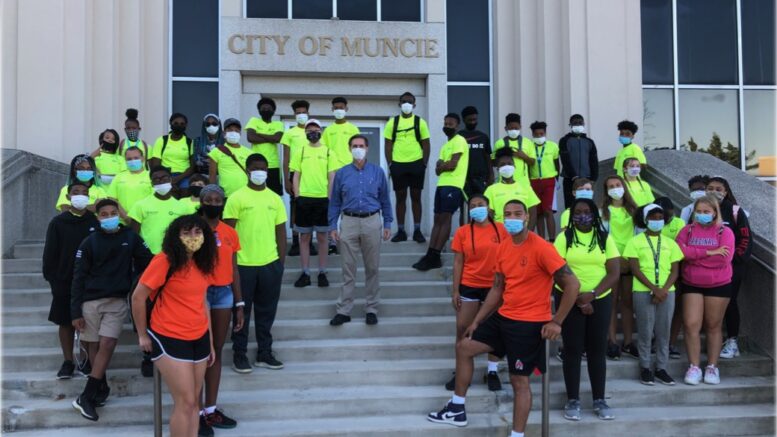 Previous summer program members are pictured with the Muncie mayor. Photo provided