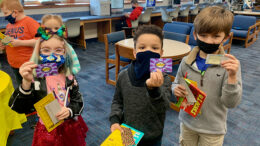 Burris students show off their new READ cards. Photo by Laura-Lea Hughes, Burris Laboratory School.