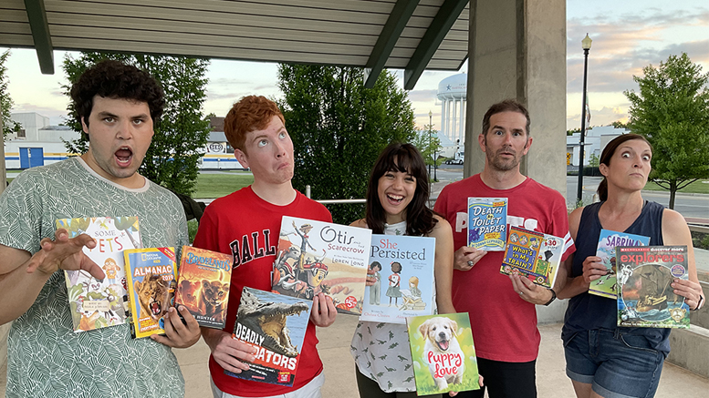 Wizard of Oz cast members Lion, Scarecrow, Dorthy, Tin Man and the Wicked Witch promoting summer reading book giveaway. Photo by: Stacy Wheeler.