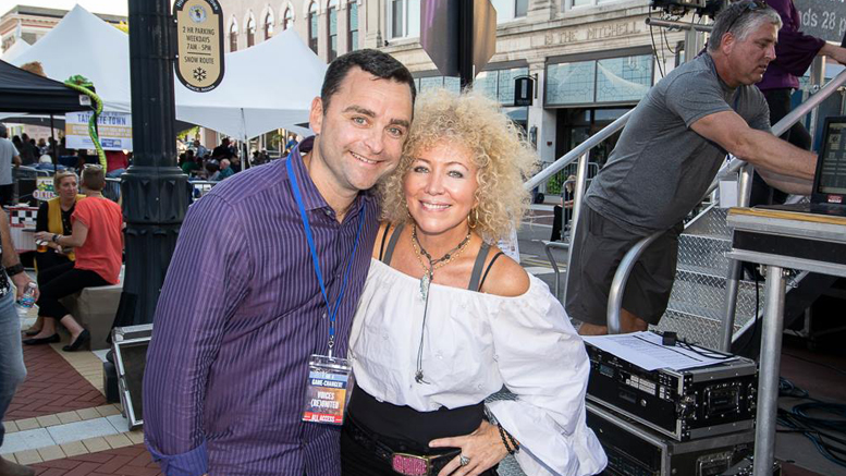 Jenny DeVoe is pictured with Casey Stanley at the United Way's "Voices (Re)United" concert in downtown Muncie. Photo by Mike Rhodes