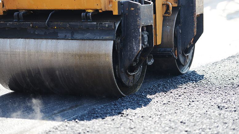 Working on asphalting a local road.