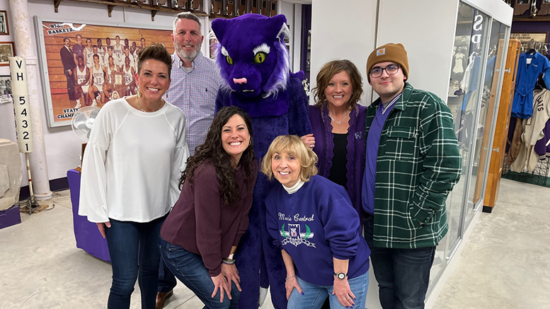 Former mascots visiting the Muncie Central Alumni Association Memorabilia Room are (front row) Melanie (maiden name: Simmons) Howe, 1996-99; Holly (maiden name: Hays) Ling., 1997-98; Nancy (maiden name: McCullough) Winkle, 1962-64; (back row) Keith Roberts, 1990-1991; Lisa (maiden name: Dalton) Doan, 1994-95; and Charlie Hammock, 2015-16.