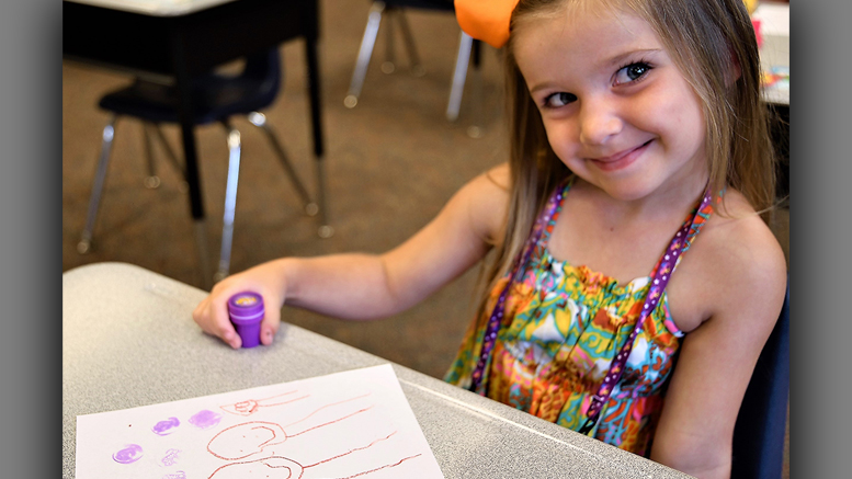 An MCS student gives the photographer a great smile. Photo provided