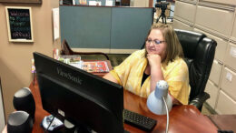 Shareen Wagley, the mayor's Executive Assistant is pictured reviewing a document on her PC. Photo provided