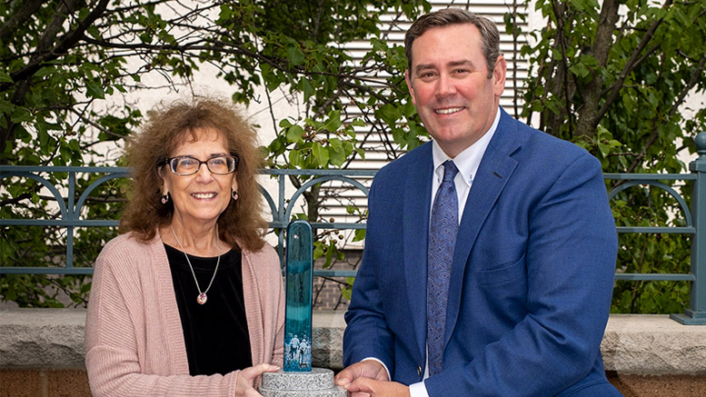 Marta Moody is pictured with Jud Fisher and her award. Photo provided